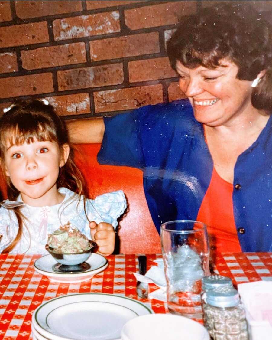 A mom and her daughter at a restaurant