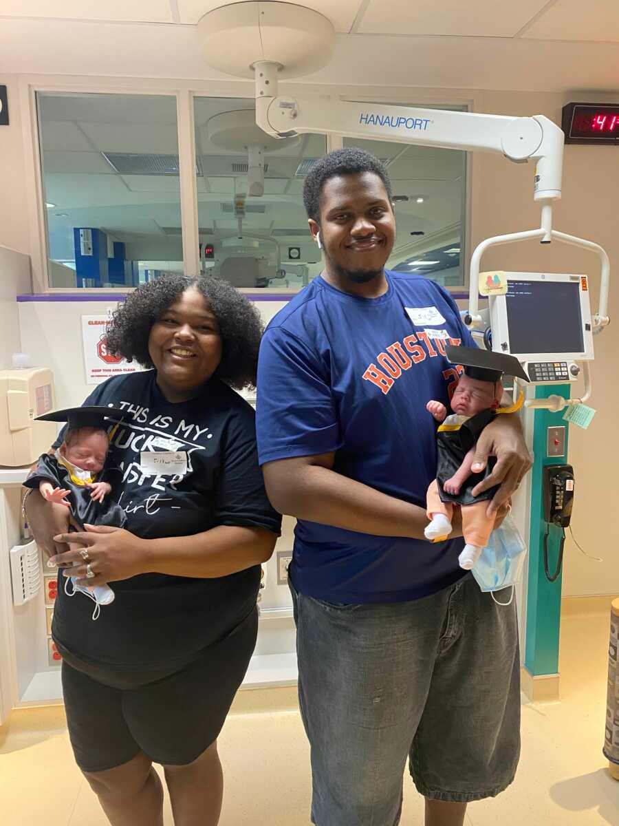 Couple holds twins graduating from the NICU.