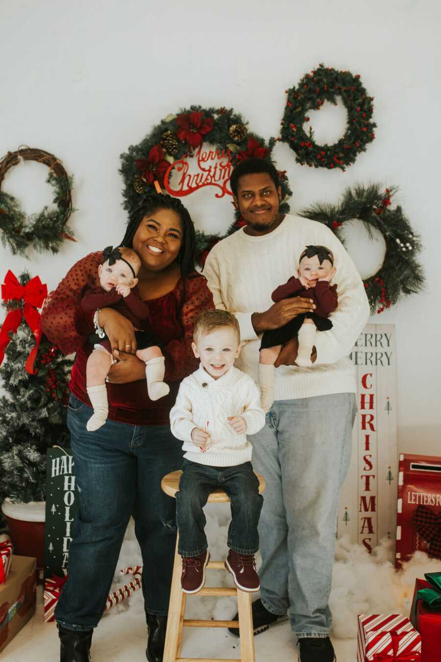 Family poses for cute Christmas pictures.