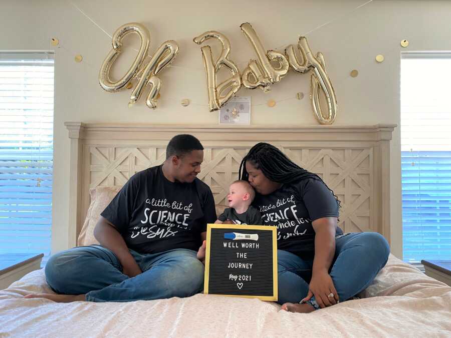 Family takes cute pregnancy announcement photo.