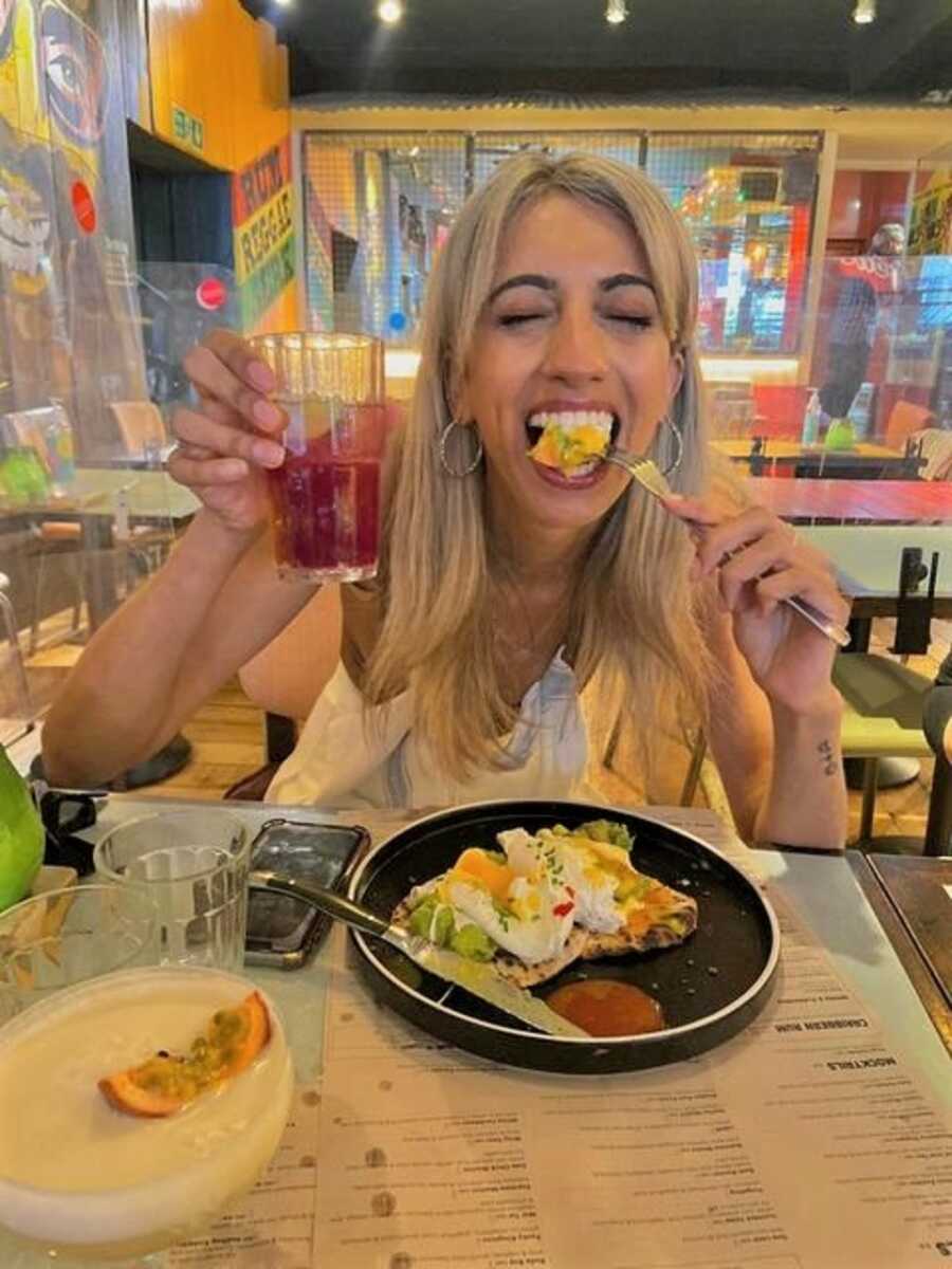Woman recovering from anorexia enjoys eating out.