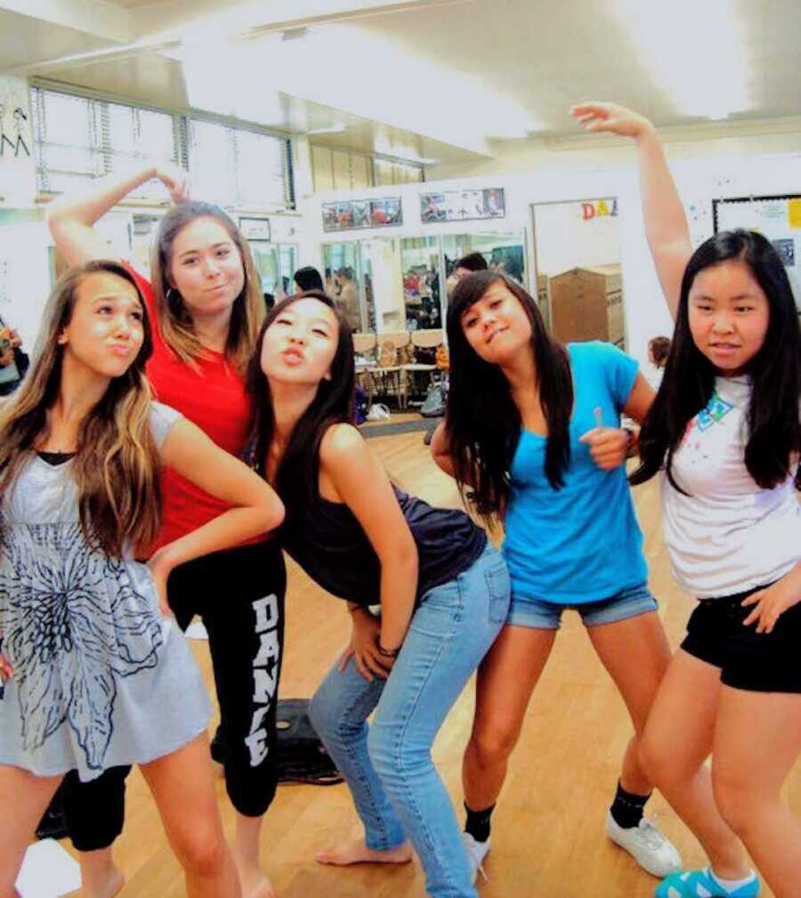 Teen girls posing for selfie in dance room