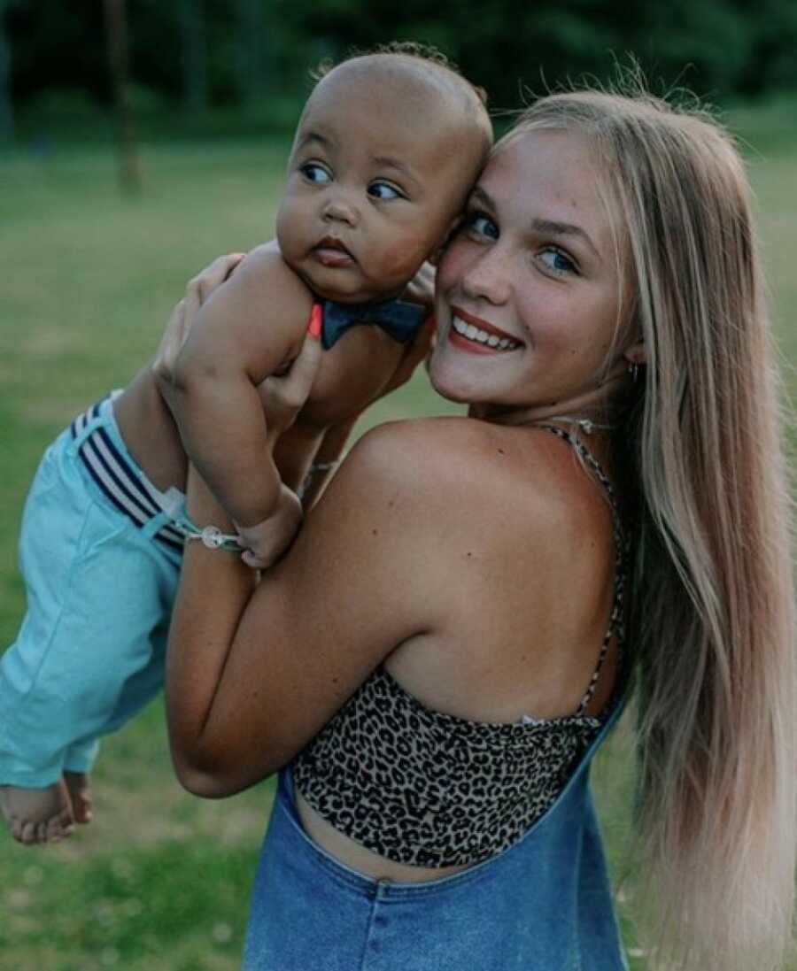 teen mom posing with her child