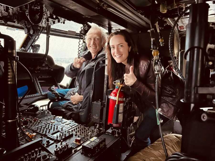 dad and daughter with thumbs up and happy