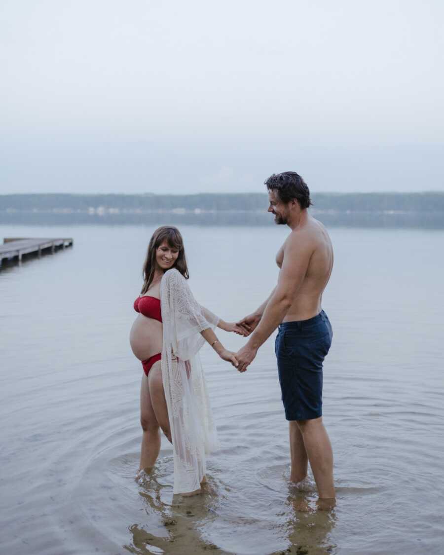 Couple expecting their sixth child earth side and first daughter have a maternity photoshoot at the beach