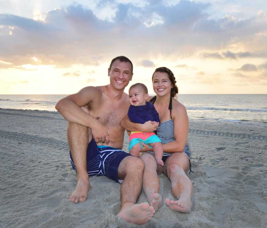 mom son and husband all together on a beach