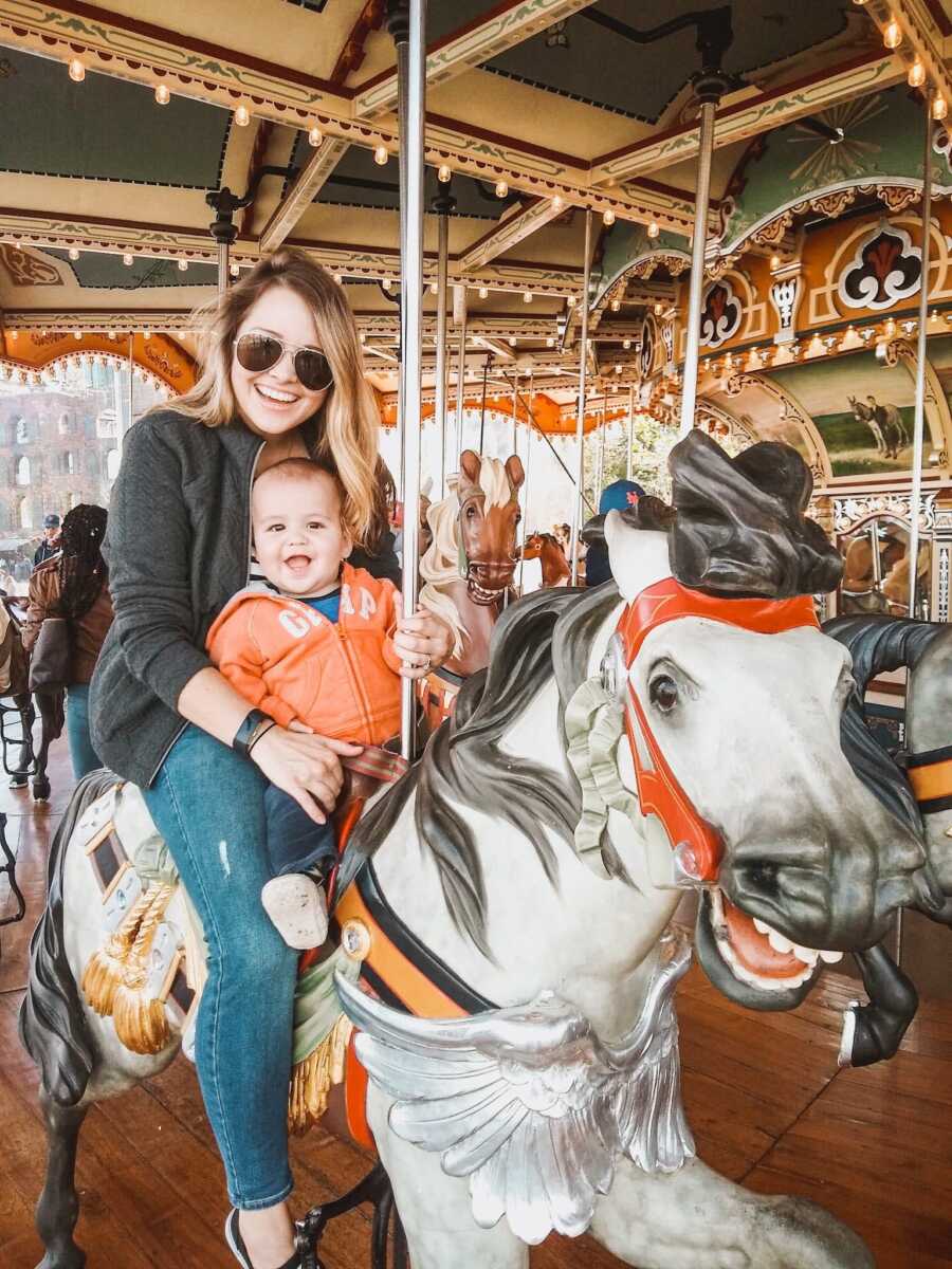 mom and baby on a carousel 