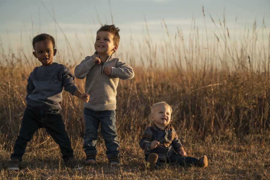 three kids posing and being happy