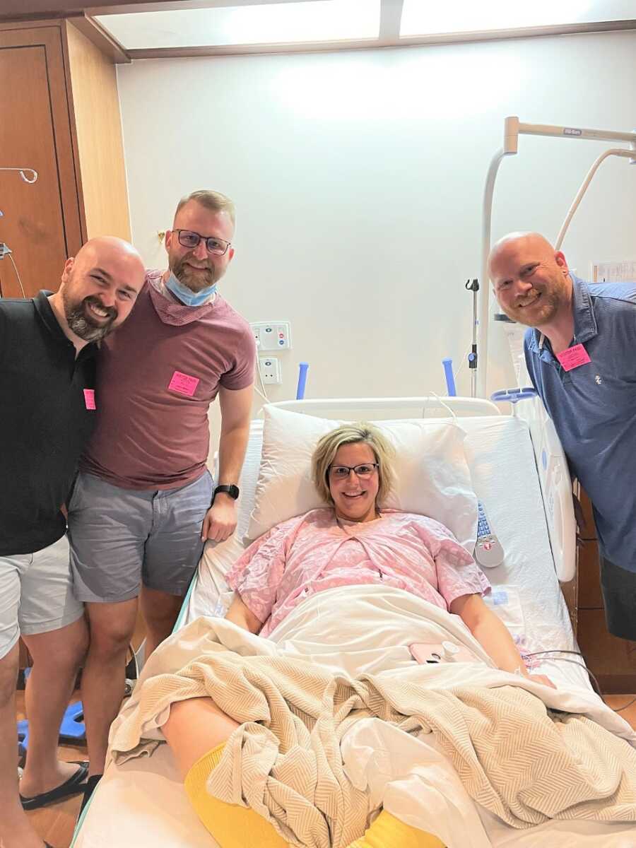 surrogate mom before labor with her husband and gay dads-to-be