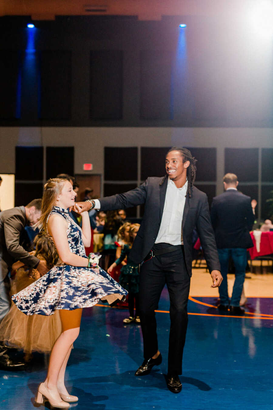 girl being twirled by her date