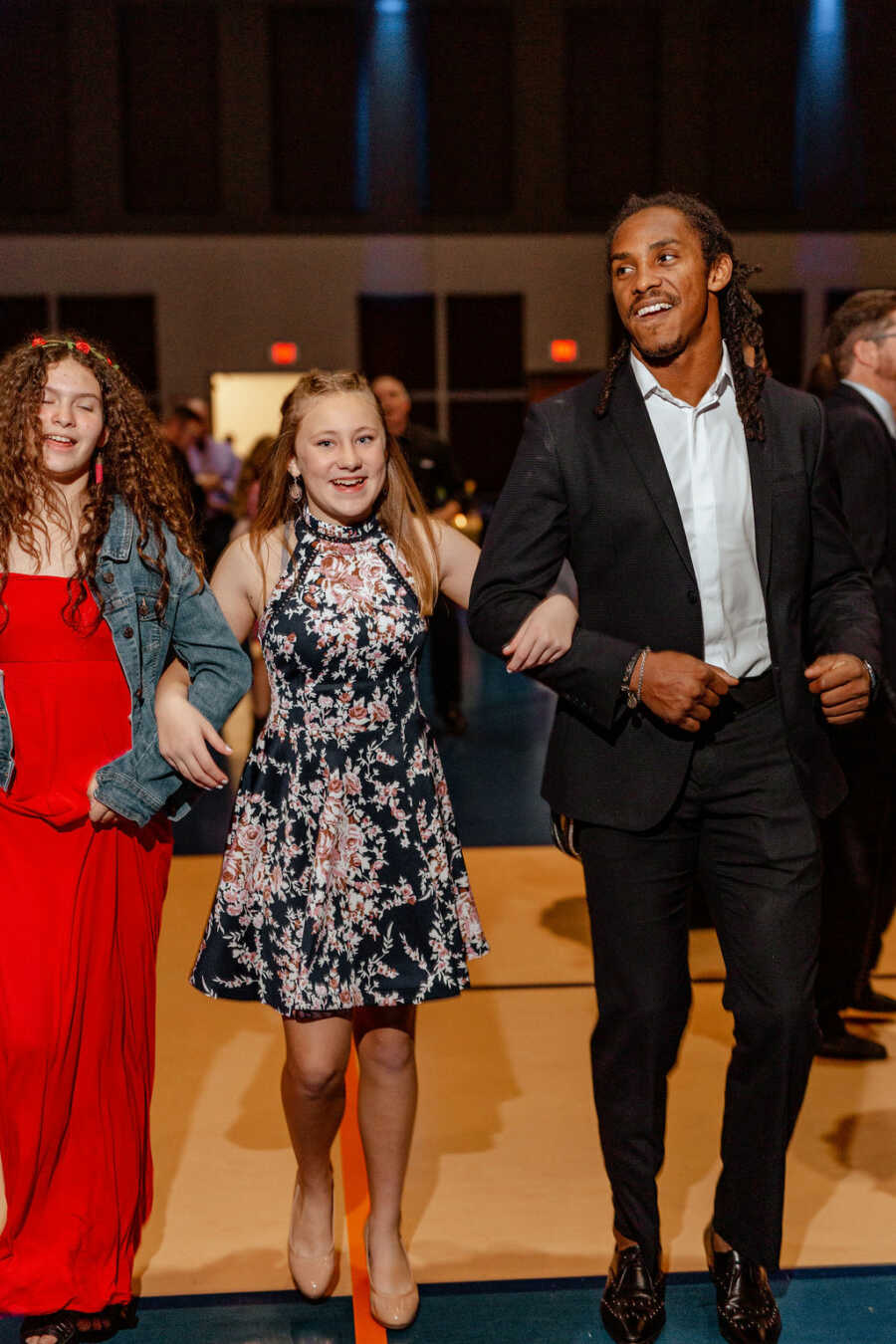 girl walking arm and arm with her date