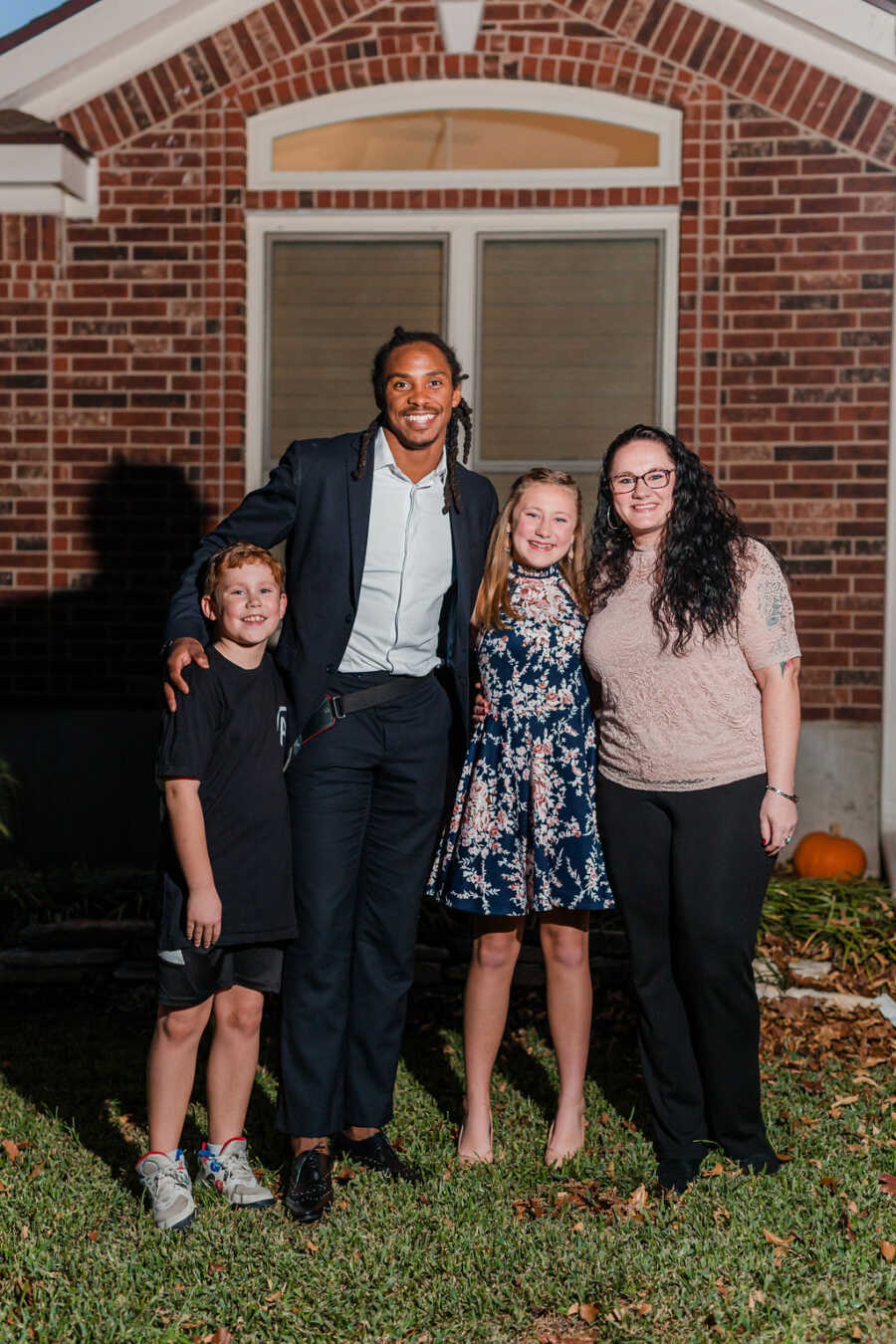 girl and her family with her date to the dance