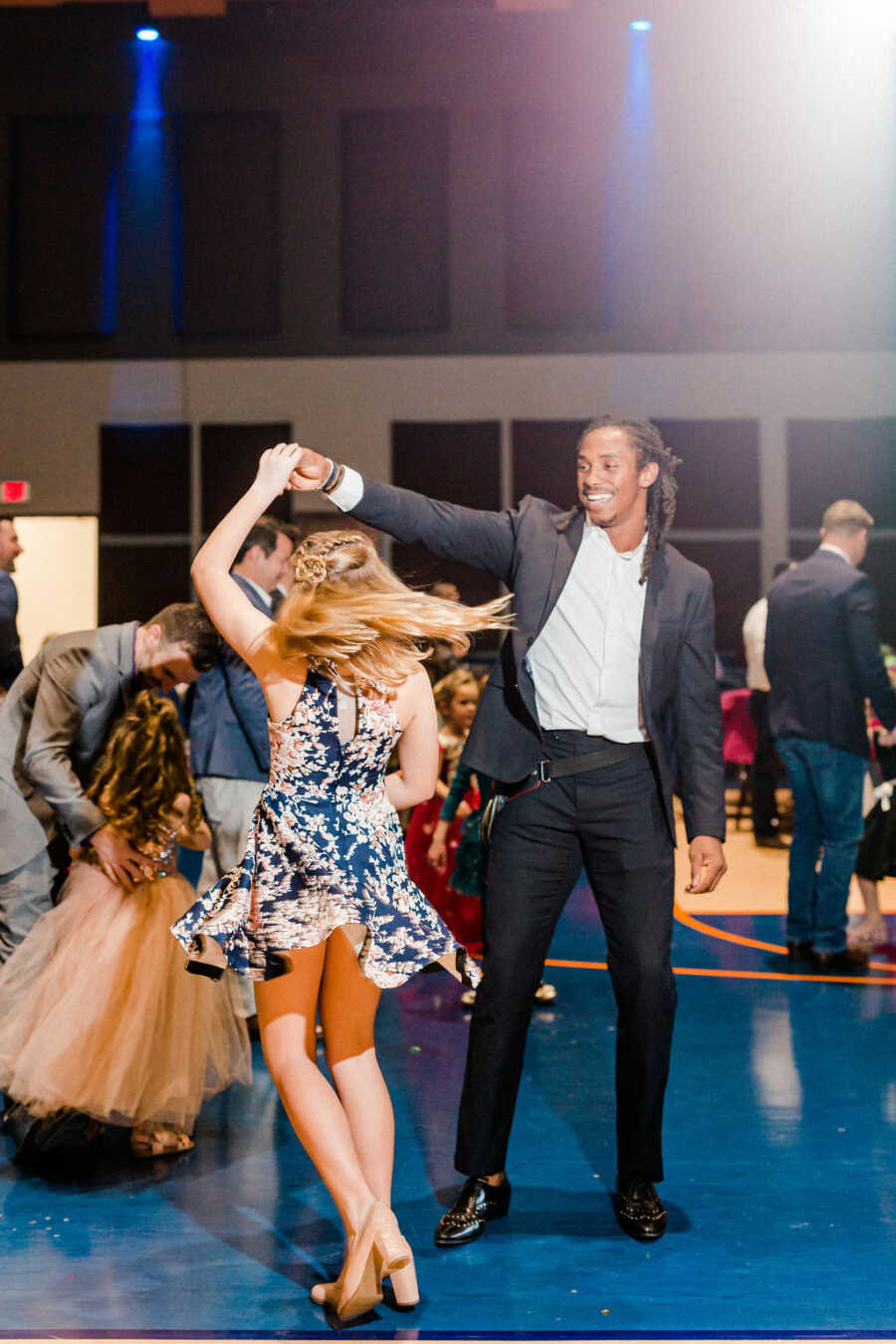 girl being twirled by her date