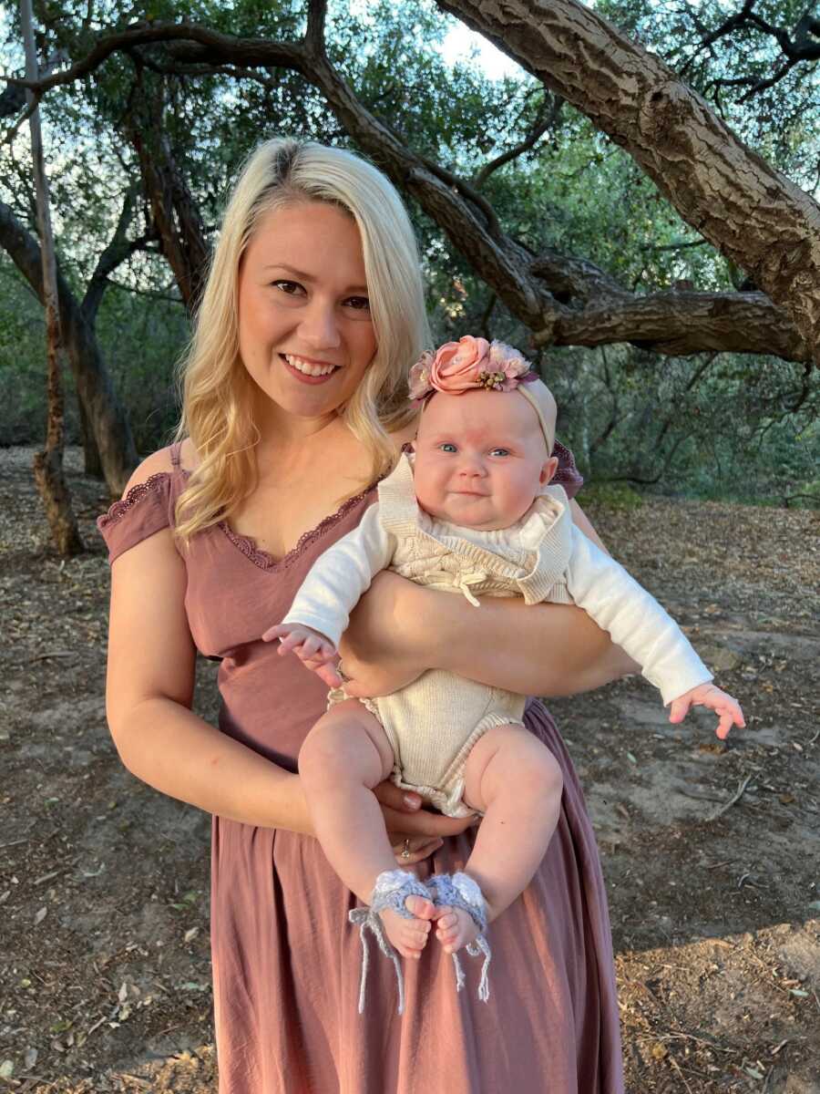 mom and her daughter posing