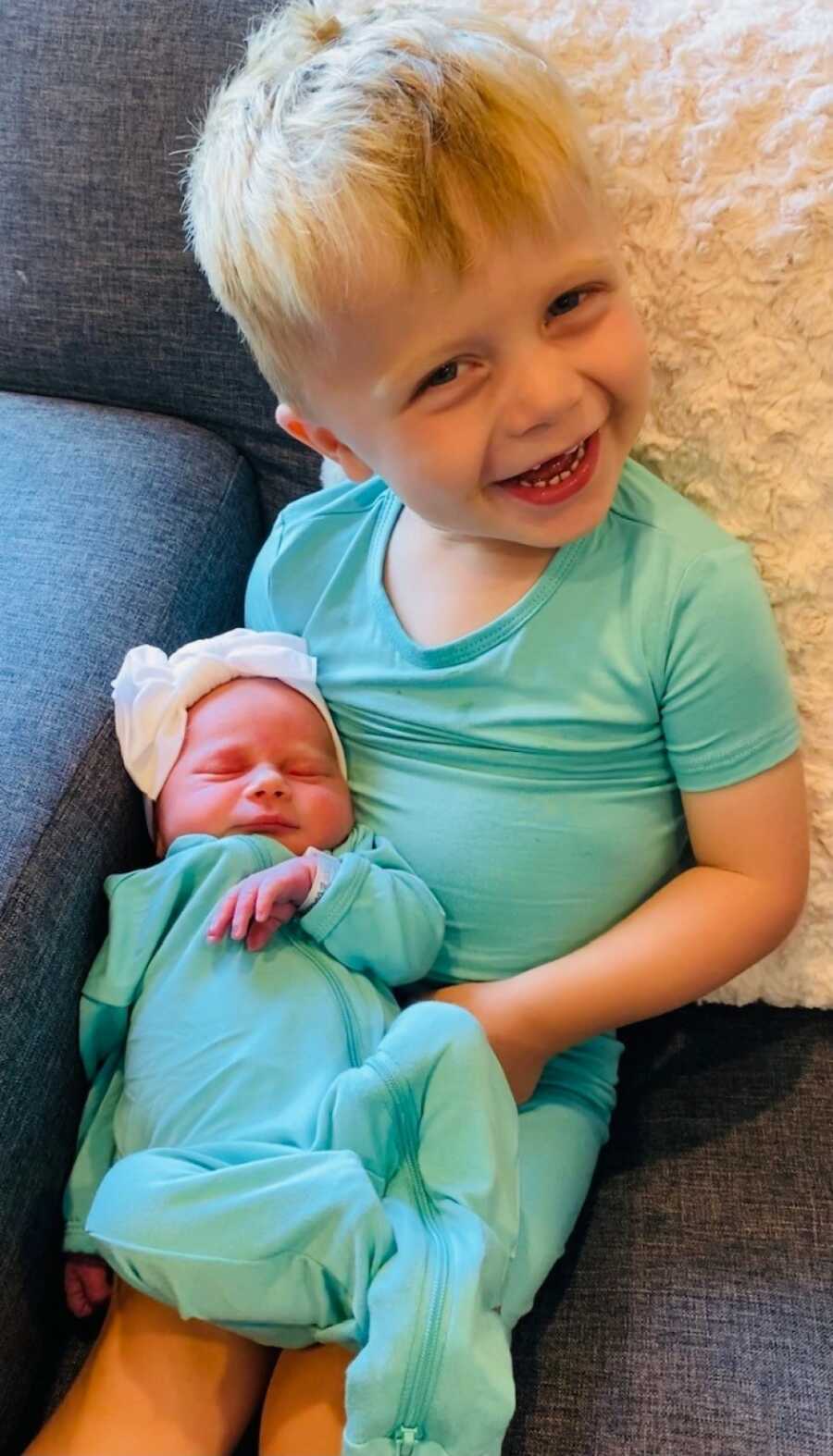older brother with his baby sister