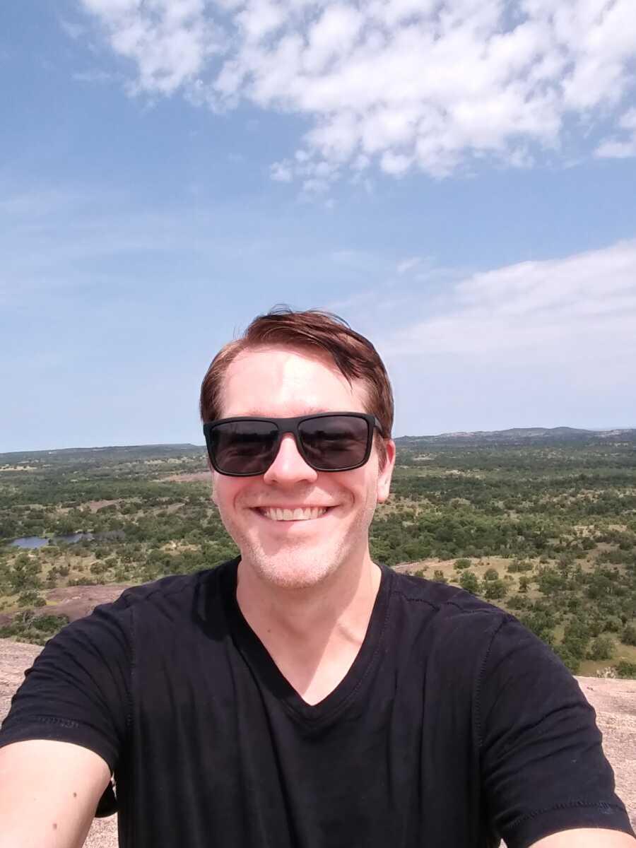 man taking a selfie and smiling