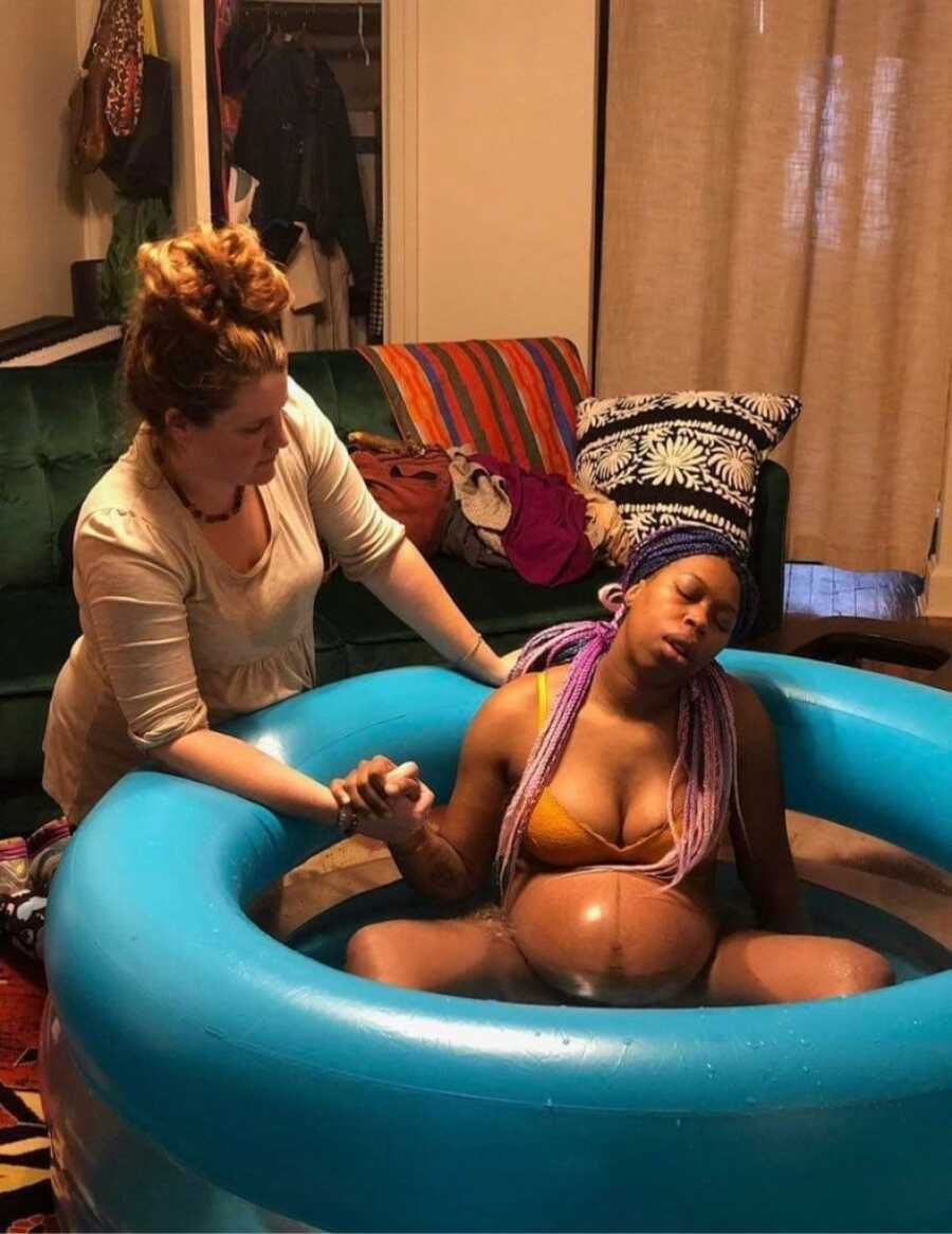 birth worker helping a mom give birth