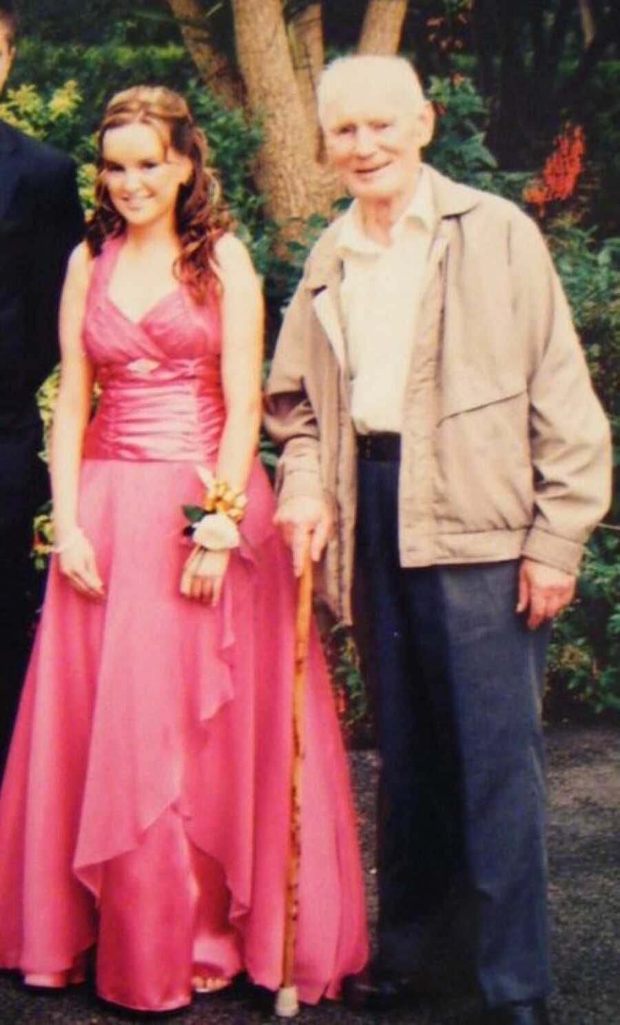 teen girl and her grandpa posing for a picture