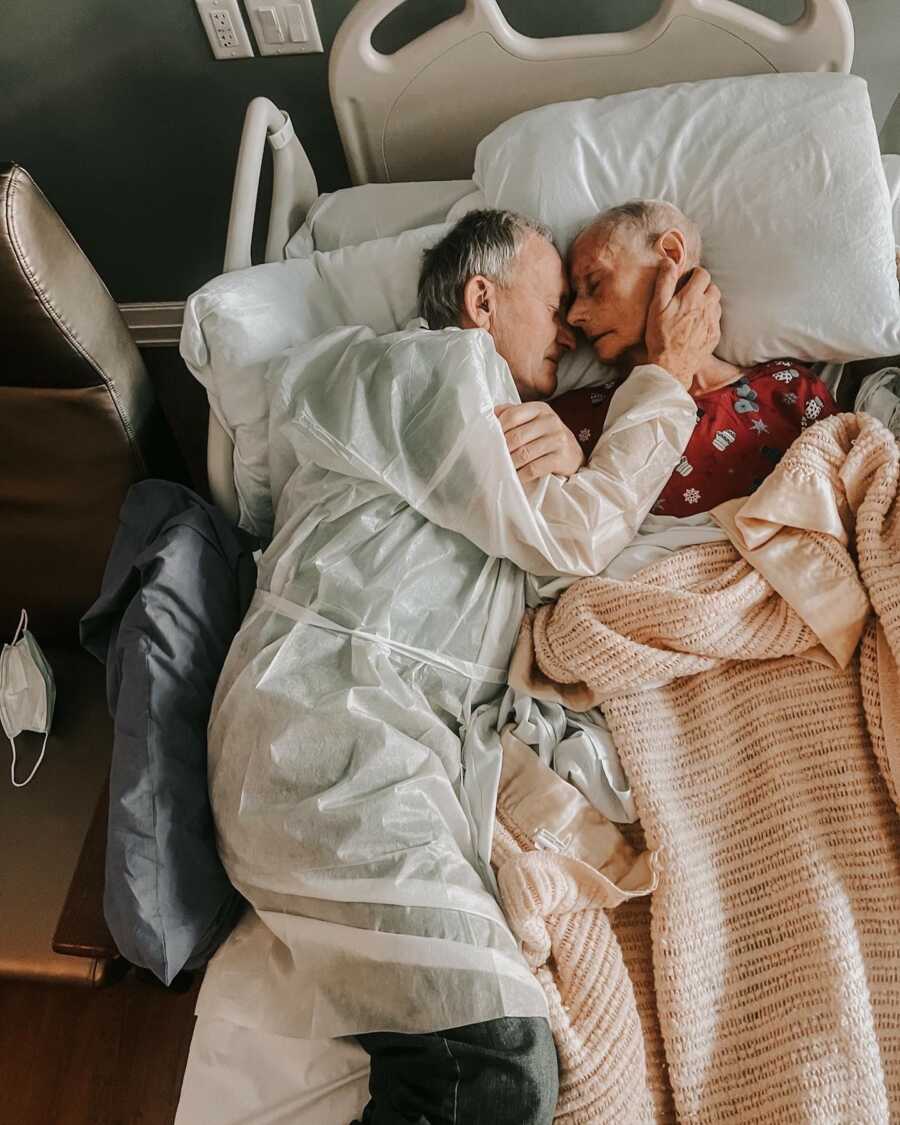 man holding his wife close before she passes