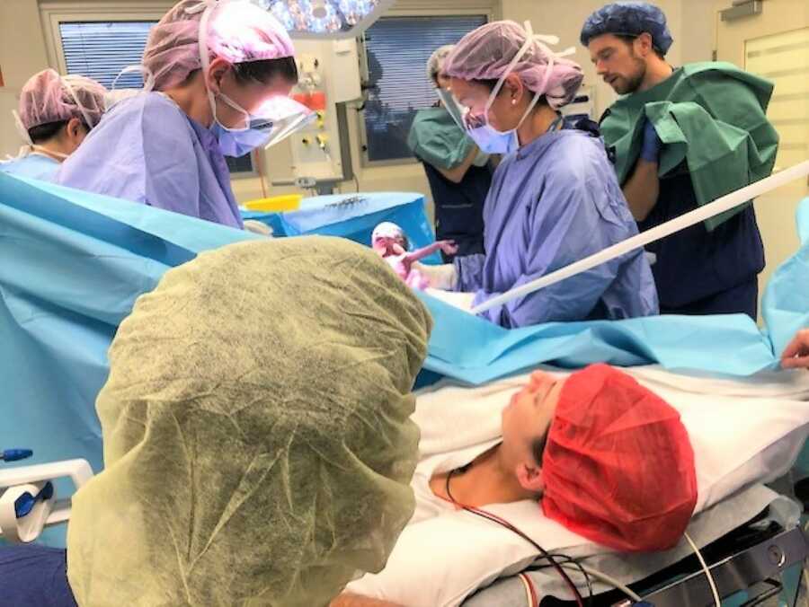 Mom delivering twin preemies during emergency C-section 