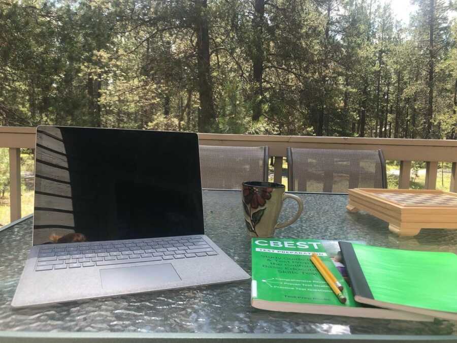 woman taking her study space outside