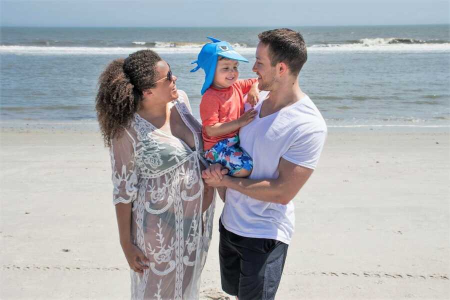 Highschool sweethearts and their kid at the beach while expecting 