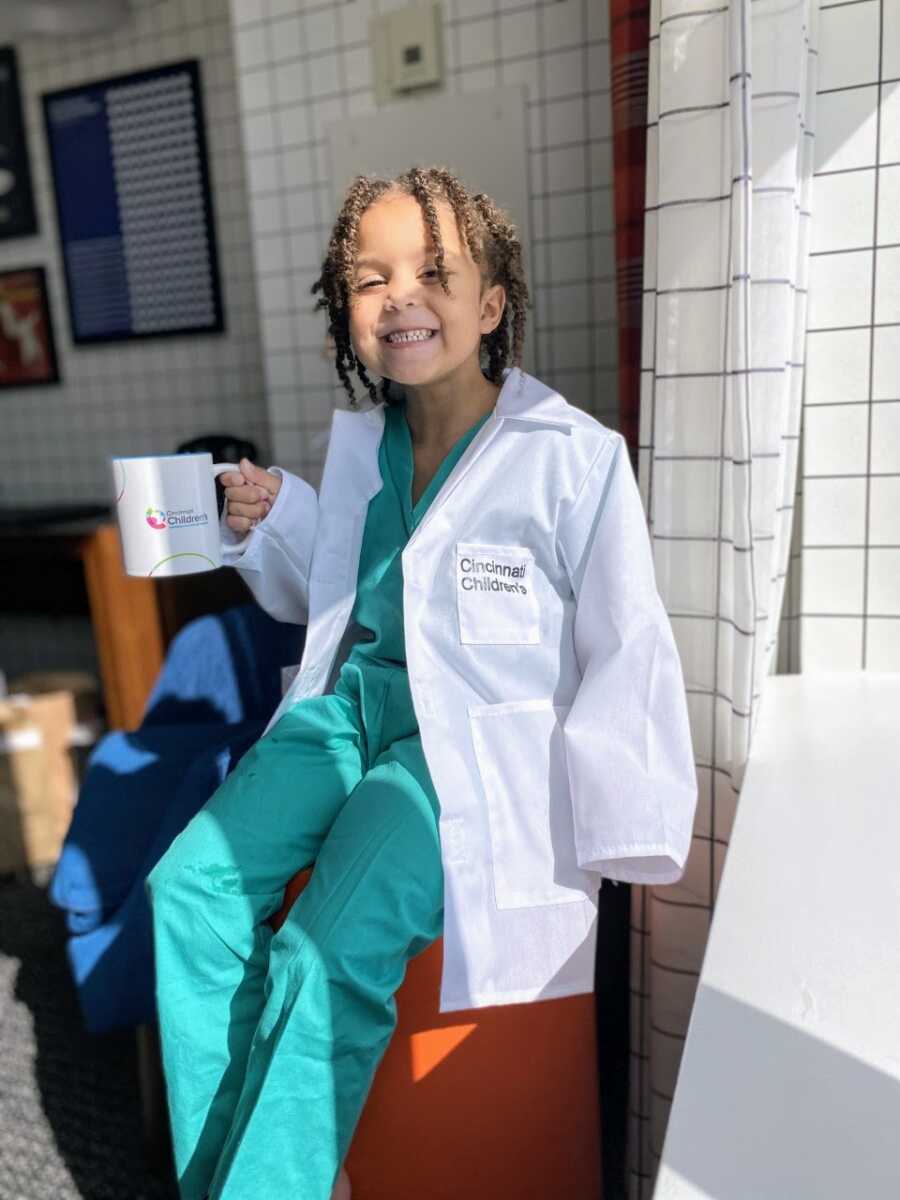 Medically complex child dresses up as a doctor while at the Cincinnati Children's Hospital