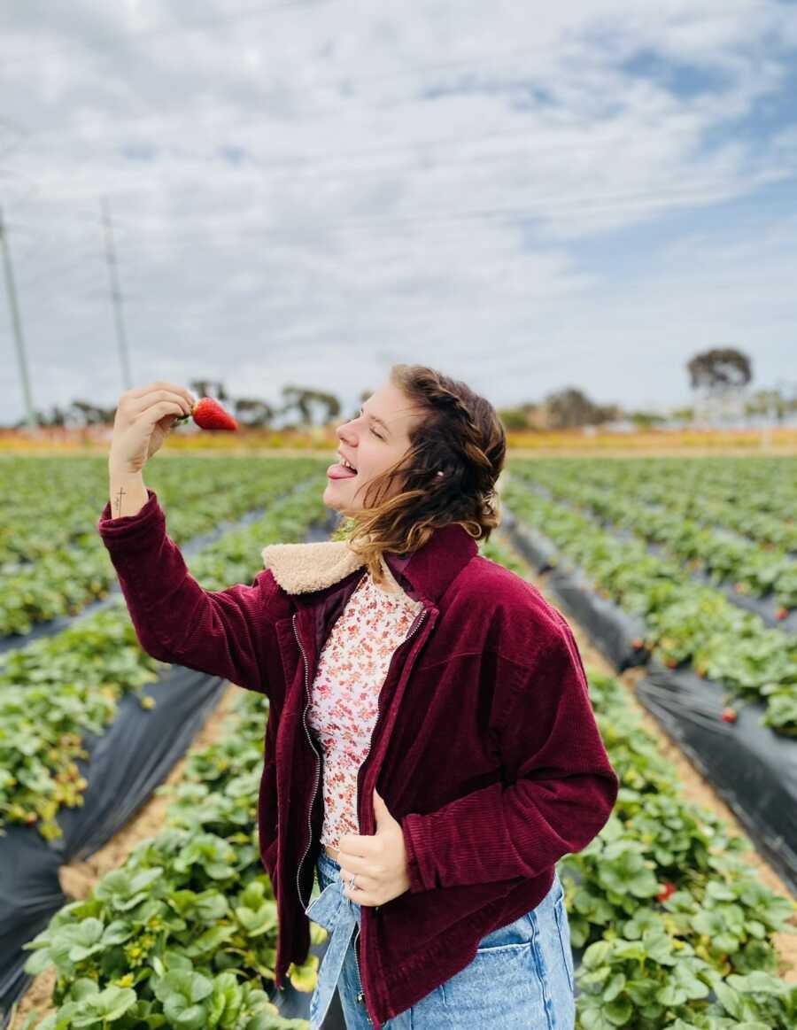 woman eating a strawberry