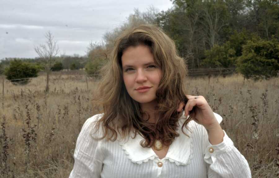 woman in a field posing