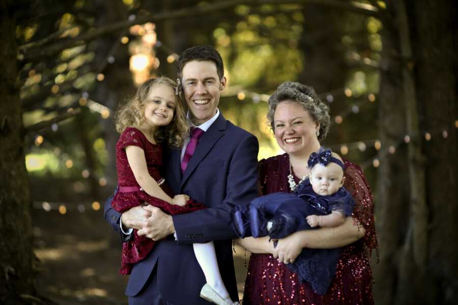 family taking a photo after mom beat breast cancer