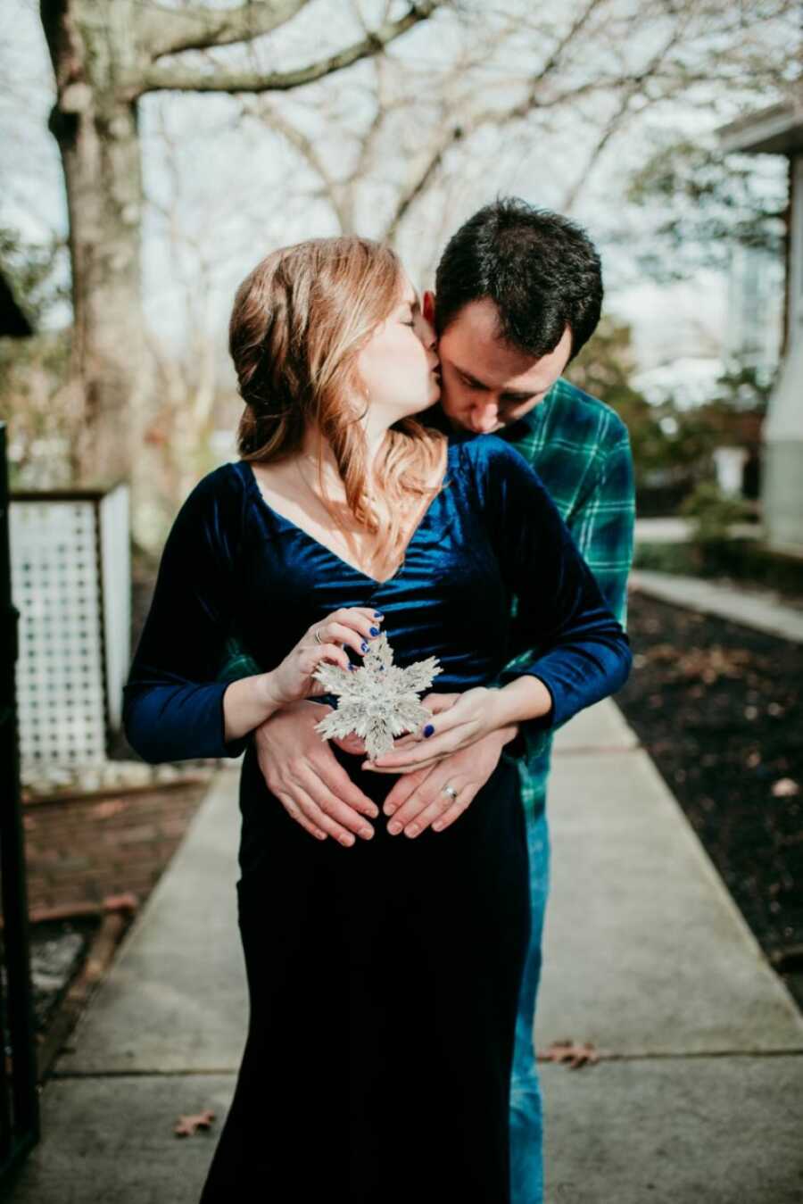 Couple celebrating their pregnancy take winter-themed photoshoot for their snowflake baby