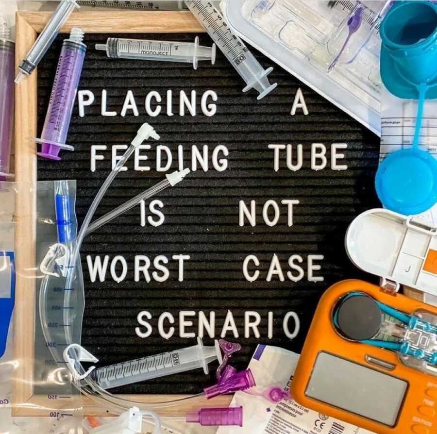 Special needs mom makes a sign that reads "Placing a feeding tube is not worst case scenario"