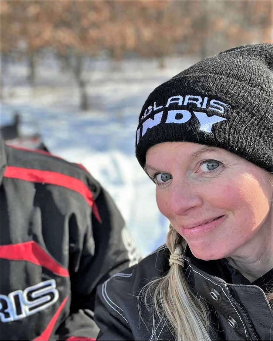 Mom tries to take selfie with son on a winter walk outdoors but ends up capturing just her and his shoulder 