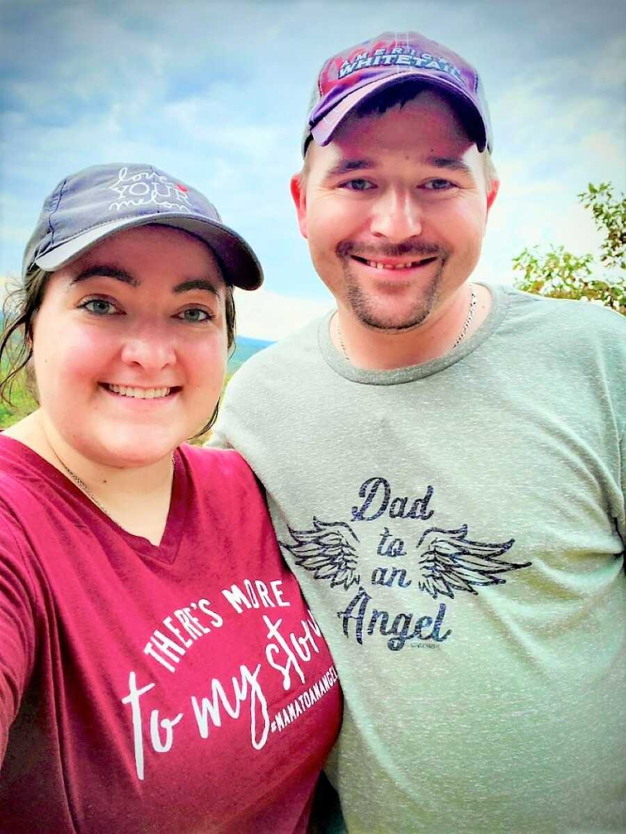 Married couple wearing a Dad to an angle shirt after miscarriage due to ectopic pregnancy 