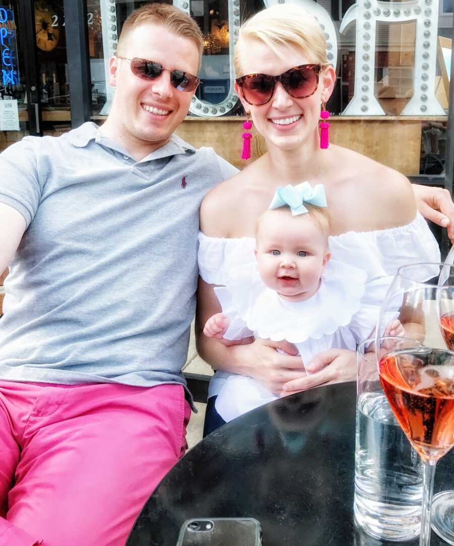 First time parents enjoy a lunch outing with their baby daughter