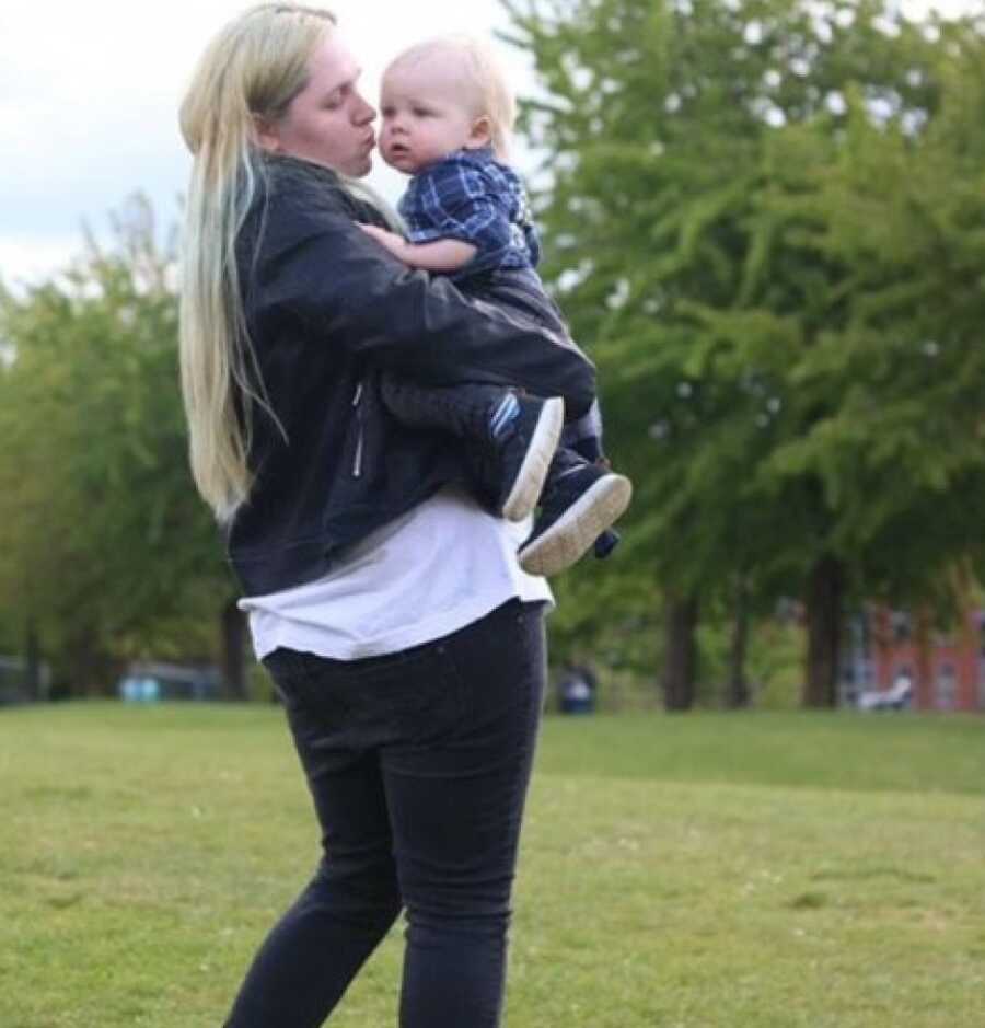 woman holding her child