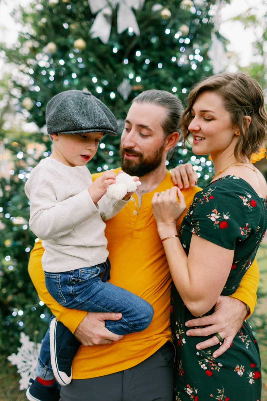 family all together around a christmas tree