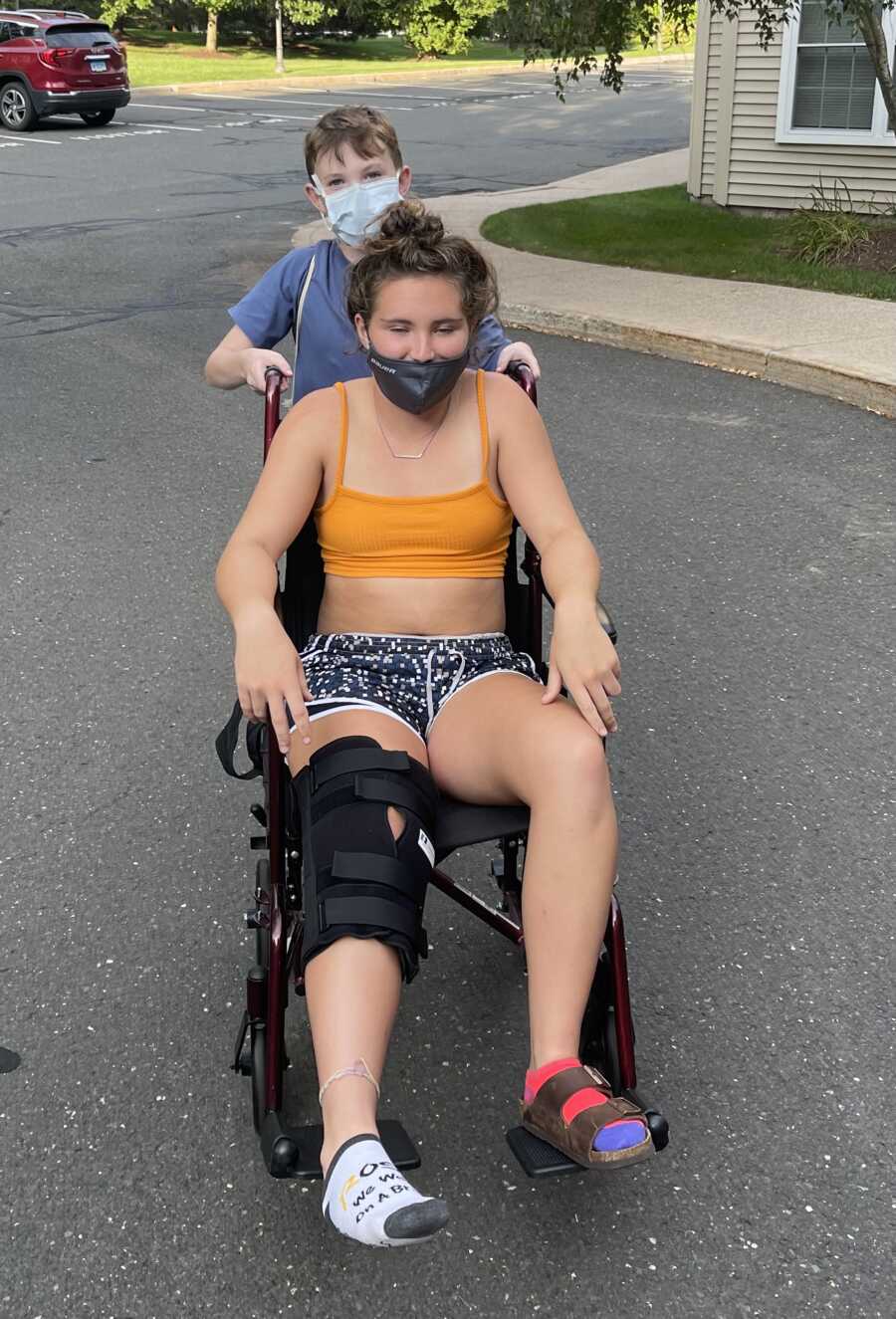 girl in wheelchair with her acl injury
