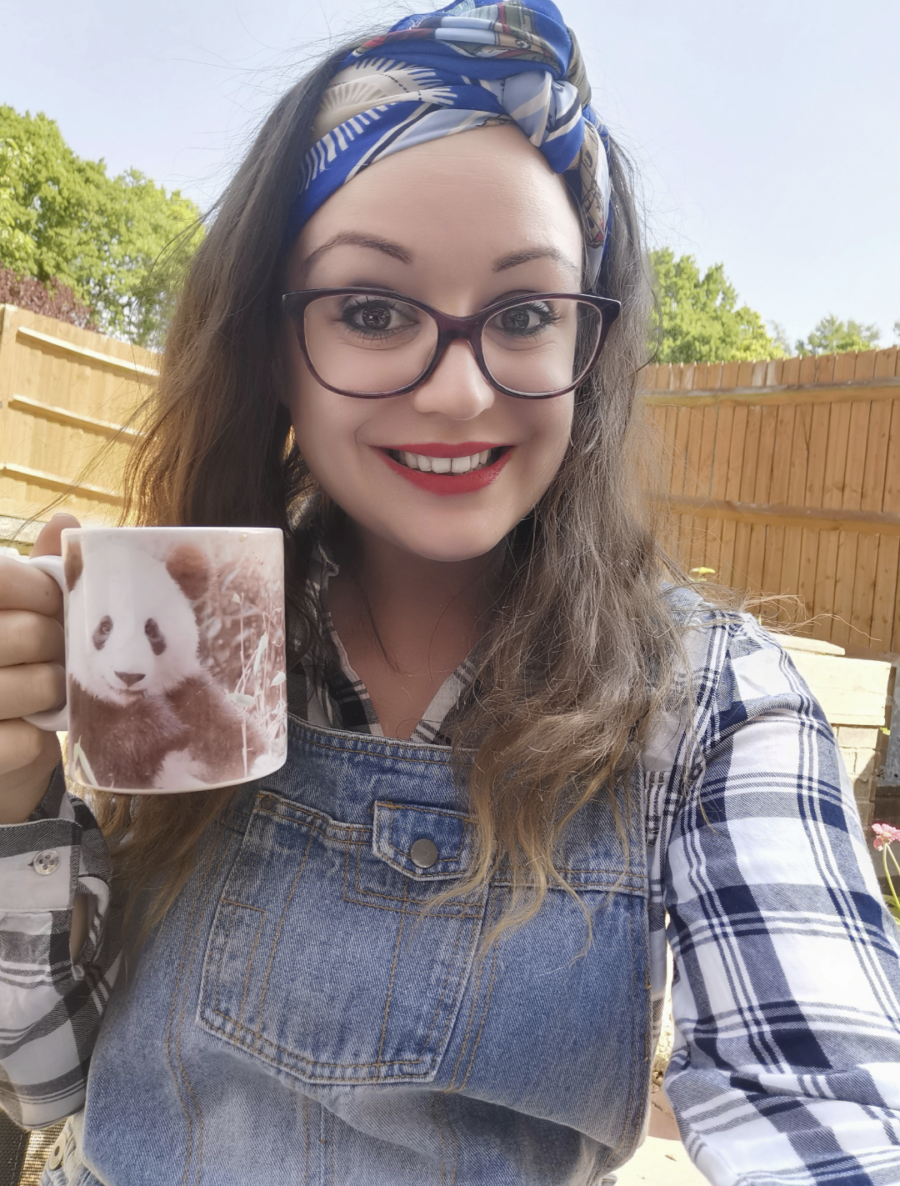 woman taking selfie with mug