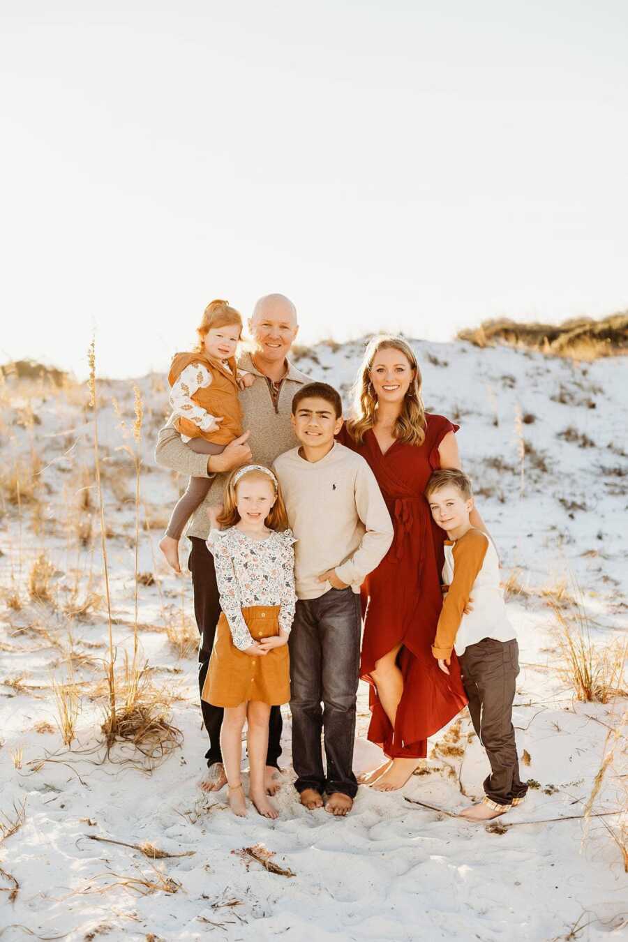 family all together on a beach