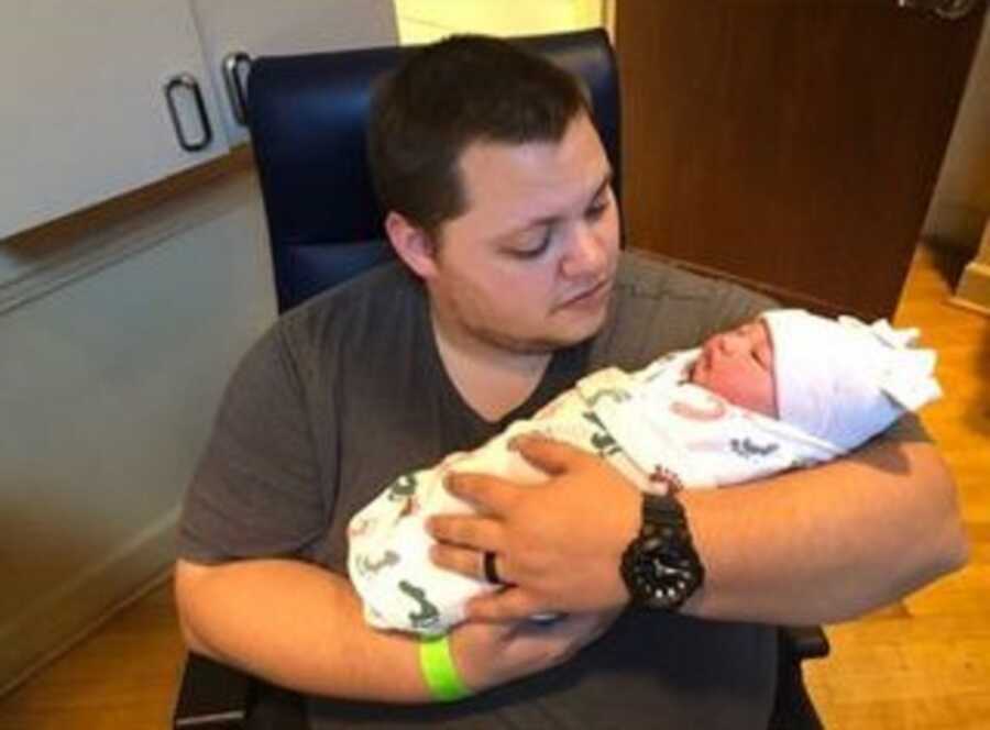 Dad holds baby girl born on February 22, 2022 at 2:22 a.m.