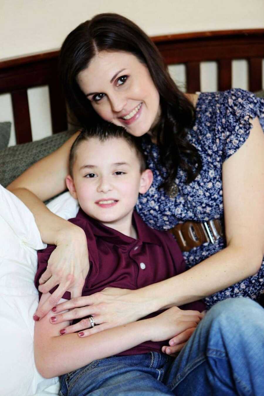Duchenne mom poses with one of her sons who has Duchenne's; both are smiling