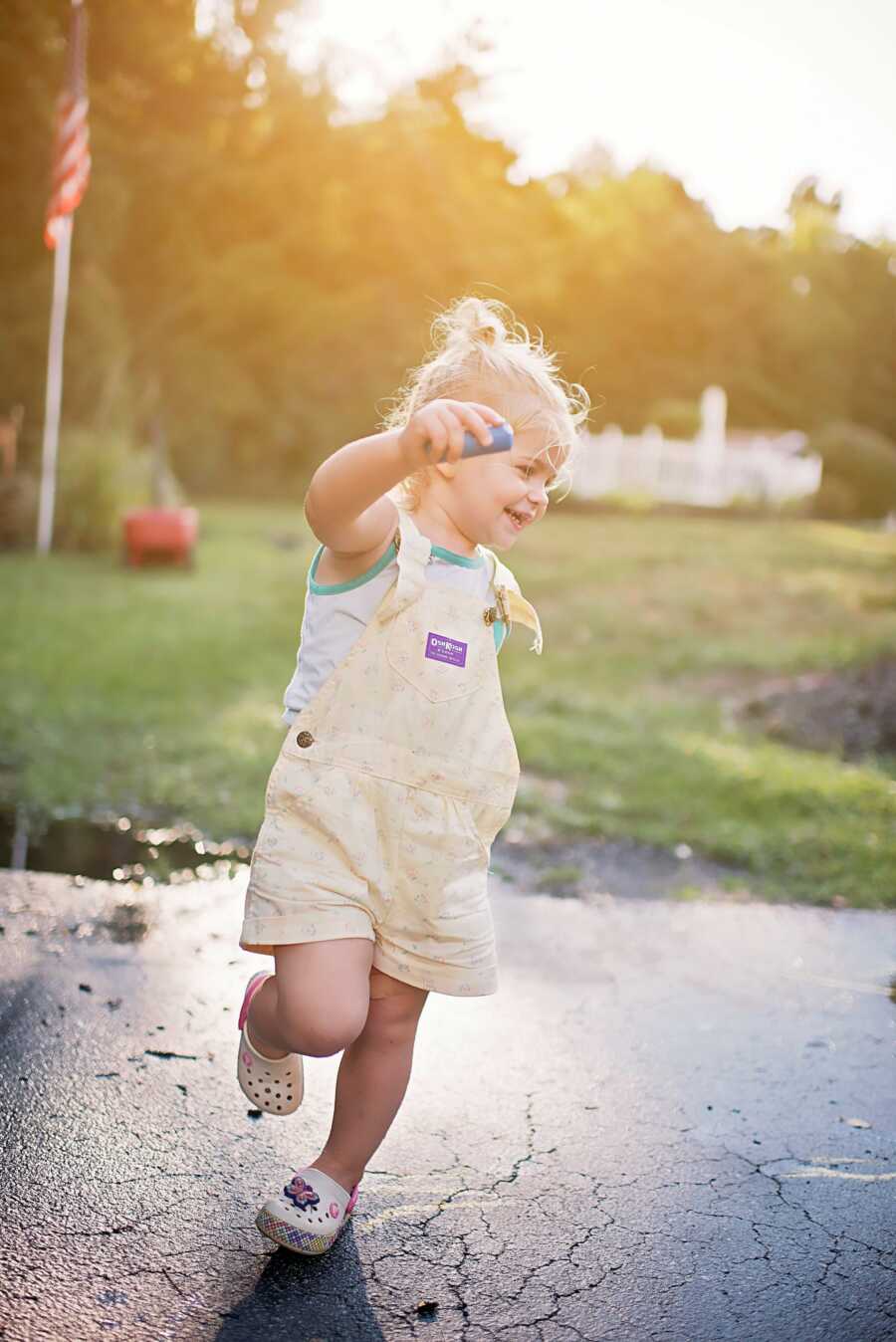 little girl with autism playing outside