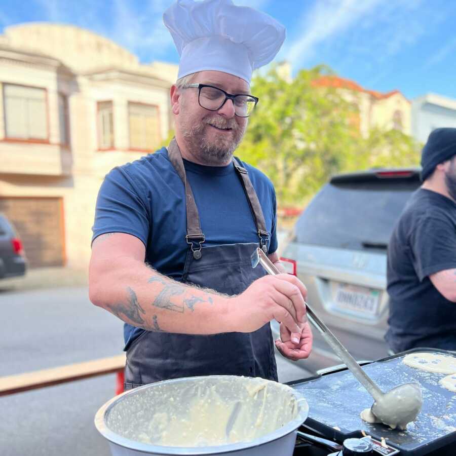 Man makes pancakes to bring together people in his neighborhood and community. 