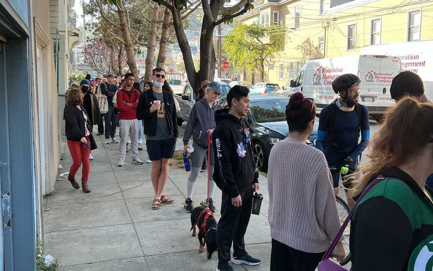 Hundreds of people in line, stretching around the corner and down the block, for free pancakes. 