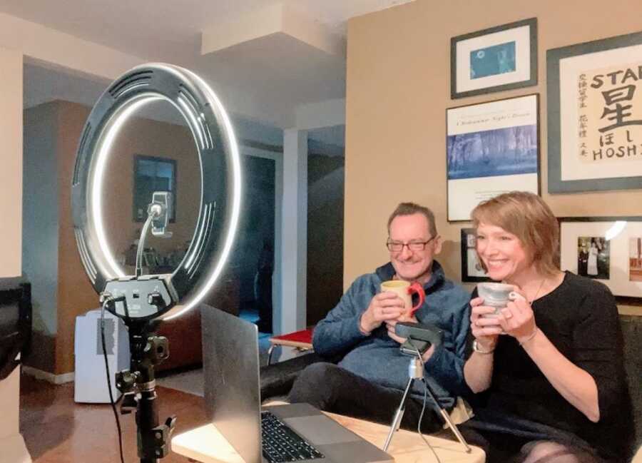 husband and wife film their podcast together in their living room
