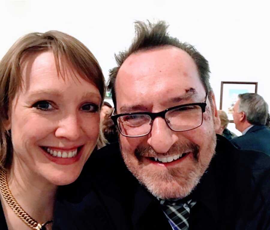 husband and wife take a smiling selfie