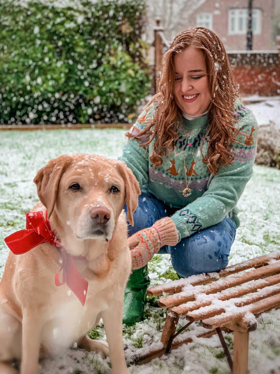 woman and guide dog in the snow