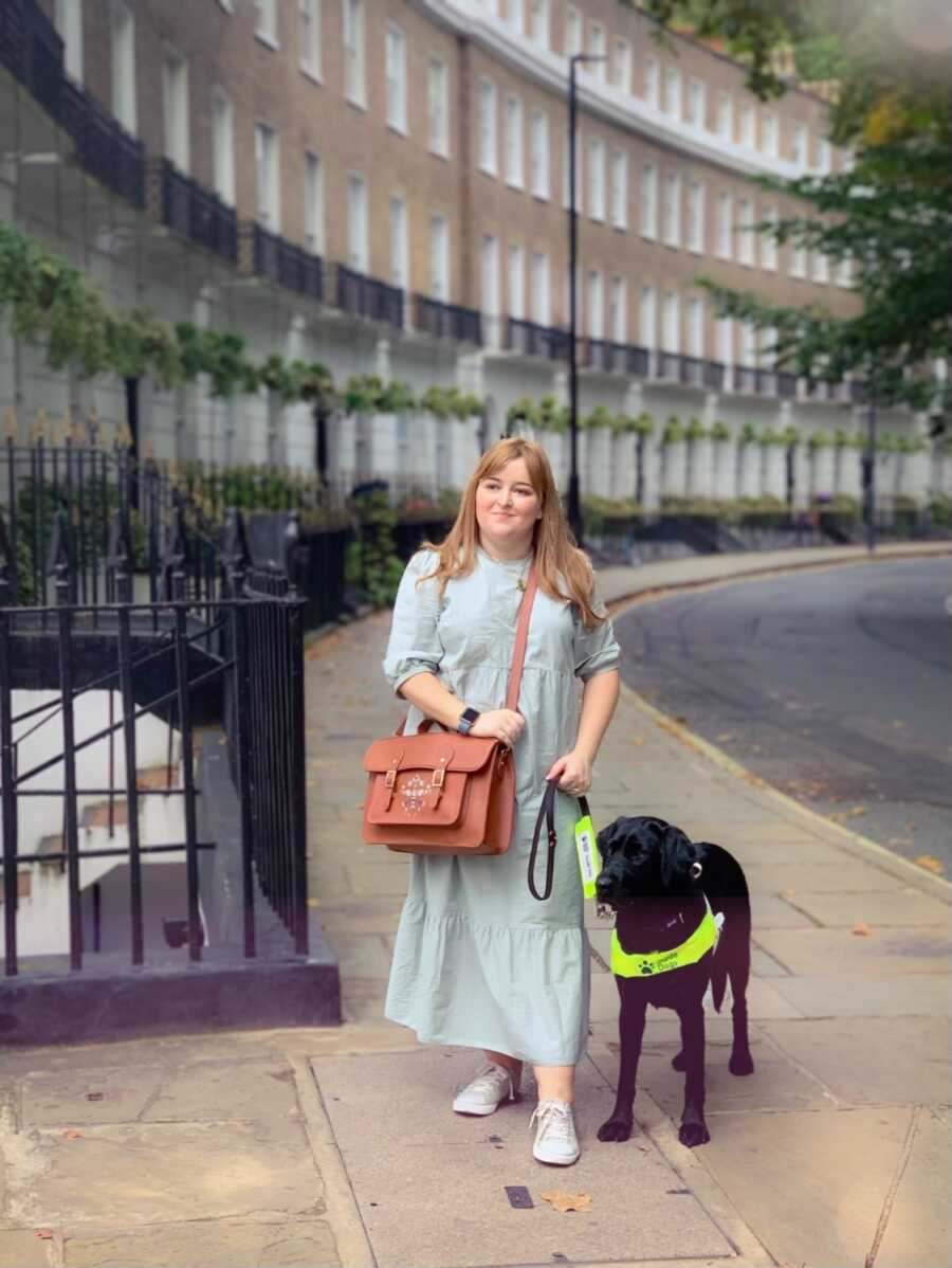 new guide dog and woman on a street