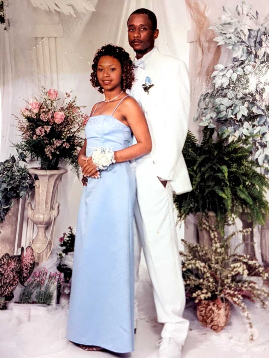 young girl and boy pose together for prom photos